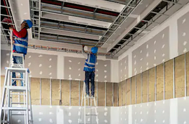 gypsum ceiling - workers doing gypsum ceiling work on site